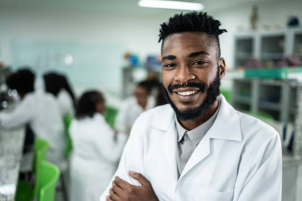 istock Portrait of a happy student in the lab 1364983825