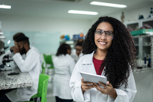 istock Portrait of a happy student in the lab 1364983833