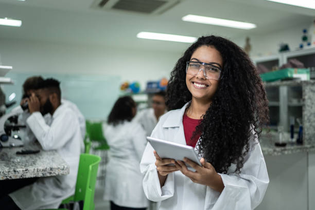 istock Portrait of a happy student in the lab 1364983842