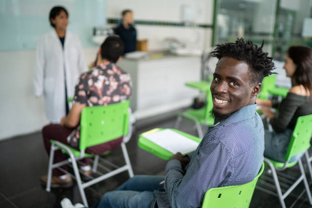 istock Portrait of a happy young man during class 1364983860