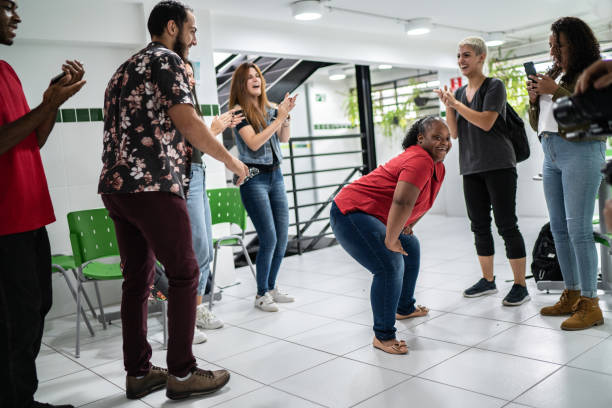 istock Group of friends dancing at school's patio 1364983946