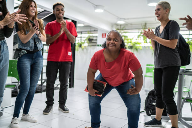 istock Group of friends dancing at school's patio 1364983964