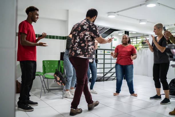 istock Group of friends dancing at school's patio 1364983990