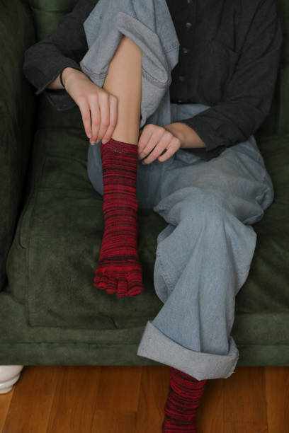 istock Feet in modern finger socks. 1364984881