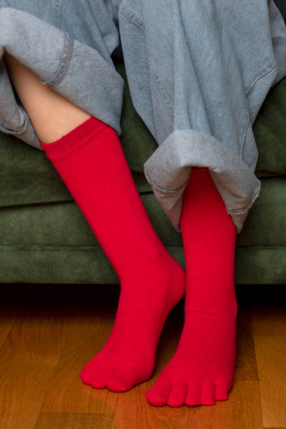 istock Feet in modern finger socks. 1364985497