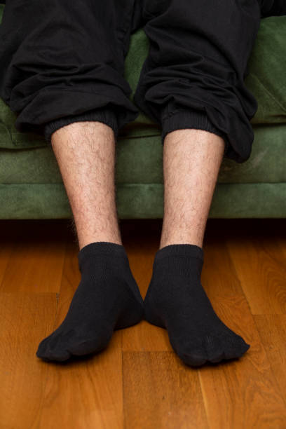 istock Feet in modern finger socks. 1364986023