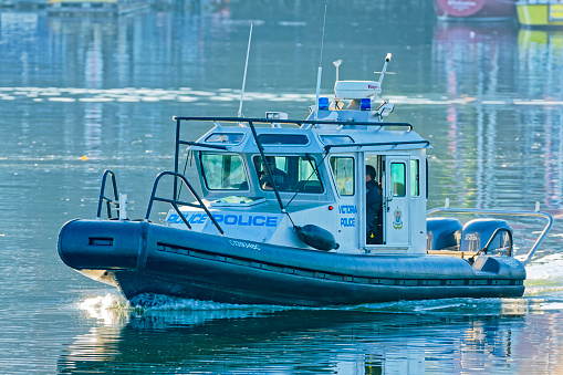 The City of Victoria on Vancouver Island  on June 28, 2008:    Police boat patrolling Victoria's inner harbor on Vancouver Island, British Columbia
