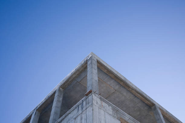 istock Low Angle View Of Unfinished Building Against Clear Blue Sky 1364987331