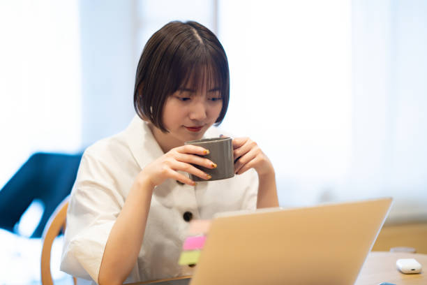 istock A woman taking a break while looking at her laptop 1364987603