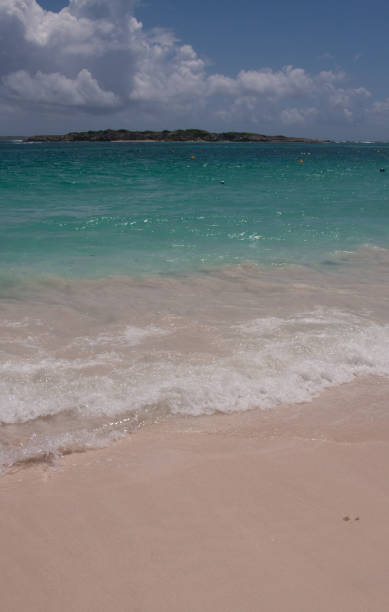 istock St. Martin beach with waves and blue sky 1364987862