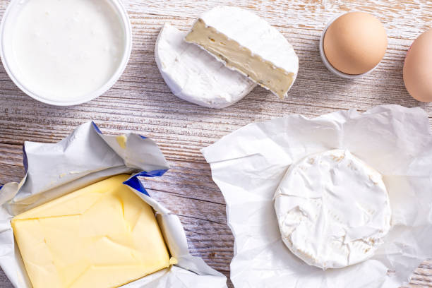 istock Yoghurt and cheeses on a wooden table. 1364988542