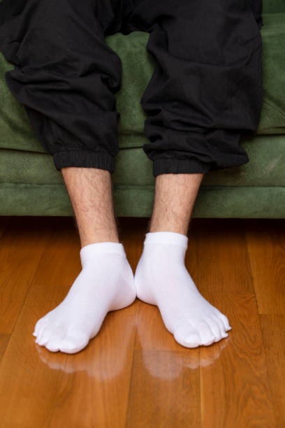 istock Feet in modern finger socks. 1364988555