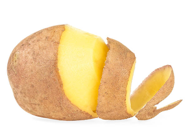 istock Peeled potatoes with peel isolated on a white background 1364989857