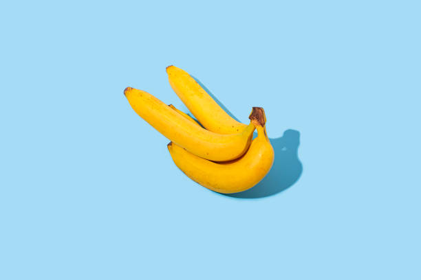istock Fresh ripe yellow bananas on a blue background. Top view, flat lay. 1364989894