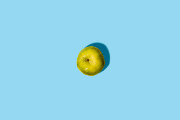 istock Fresh green apple on a blue background. Top view, flat lay. 1364990213