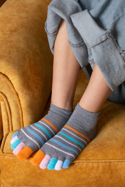 istock Feet in modern finger socks. 1364991240
