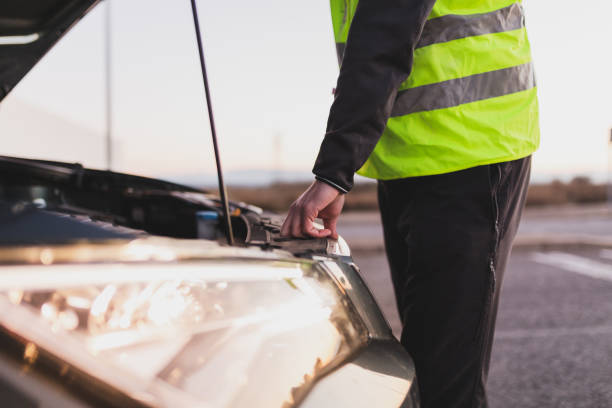 istock Man with car breakdown calling the assistance tow truck. 1364991949