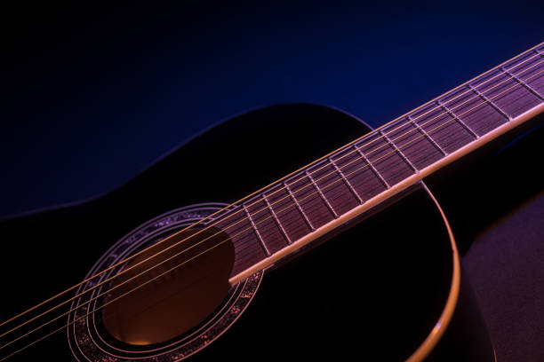 istock black guitar side view close-up. guitar music low-key concept 1364993218