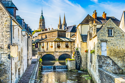 Colorful Old Buildings Mill Cathedral Aure River Reflection Bayeux Center Normandy France.  Bayeux founded 1st century BC, first city liberated after D-Day