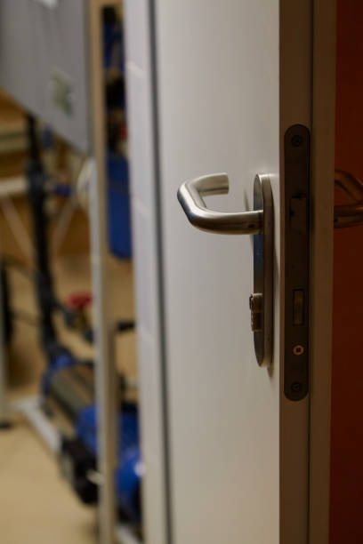 istock Metal handle on plastic door close up 1364994964