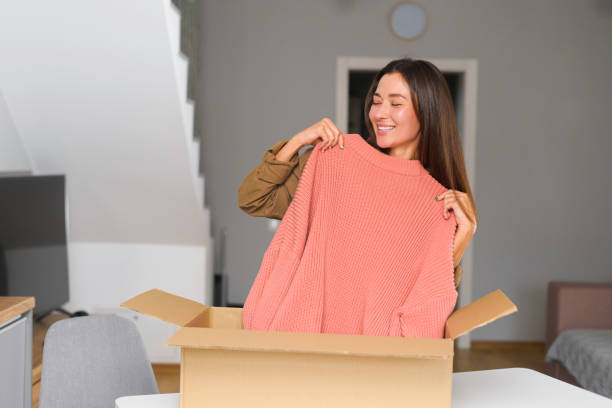 istock Satisfied Asian female customer happy with fast delivery and shipment 1365003033