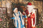 Actors dressed in traditional Christmas costumes on the doorstep studio shoot