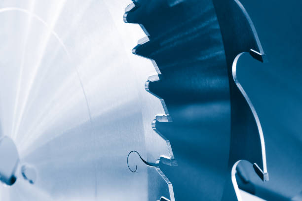 istock Automatic disksaw sawing metal workpiece, industrial concept background close-up 1365004929