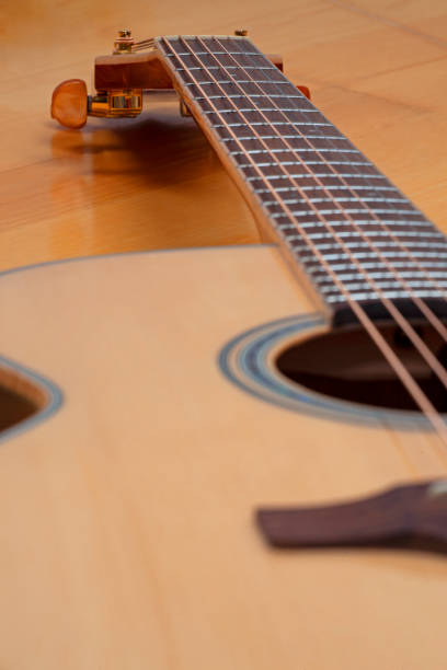 istock new acoustic guitar close up 1365005002