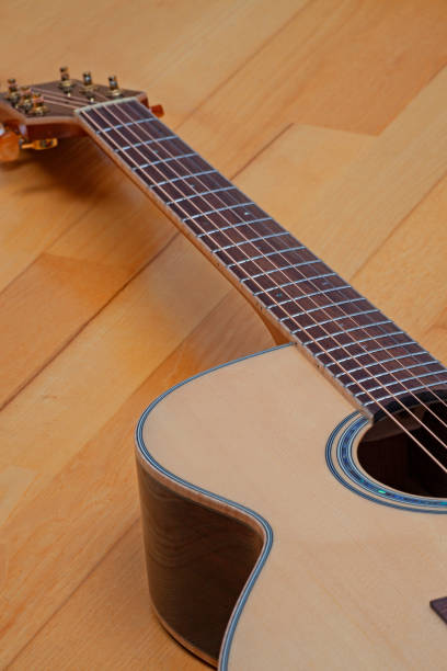 istock new acoustic guitar close up 1365006247