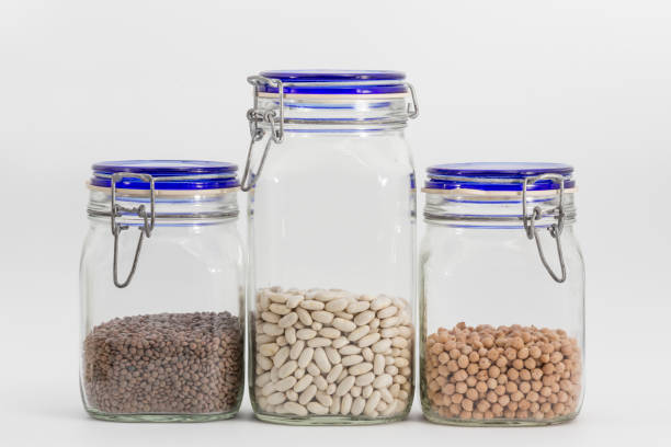 istock pantry jars with raw food on white background 1365007515