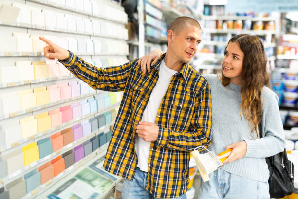 istock Woman and man consumer choosing tiles color samples in hardware store 1365013082