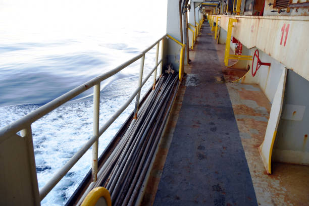 Main deck of container vessel during sailing through calm sea.