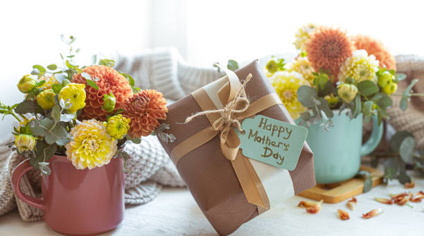 istock Festive composition for mother's day with gift box and flowers. 1365014747