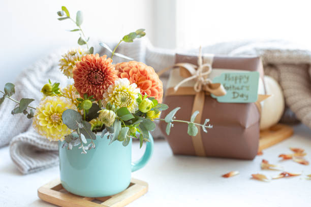 istock Festive composition for mother's day with gift box and flowers. 1365014749