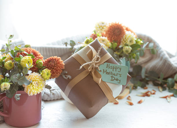 istock Festive composition for mother's day with gift box and flowers. 1365014753