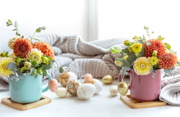 istock Easter composition with a bouquet of flowers and eggs on a blurred background. 1365014754