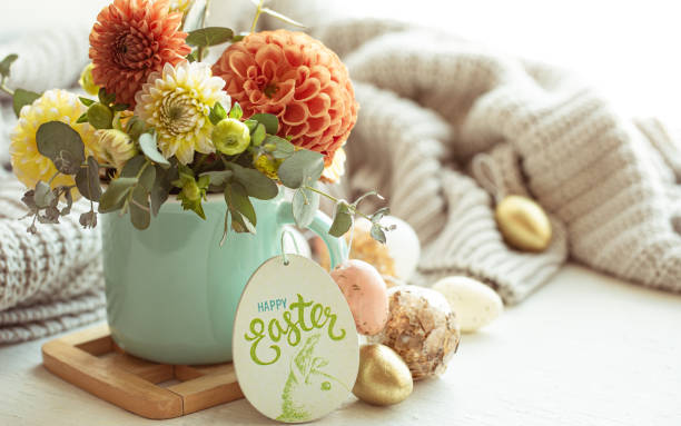 istock Easter composition with a bouquet of flowers and eggs on a blurred background. 1365014759