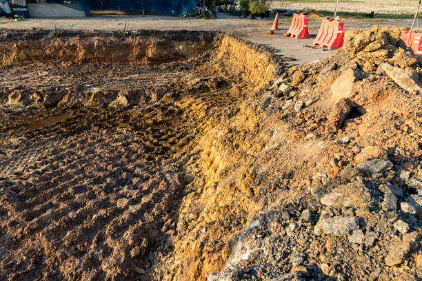 istock Side of the broken asphalt road collapsed and fallen. Road collapses. Layer of soil beneath section. Cracked asphalt road. construction site 1365015929