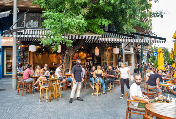 People visit street restaurant in Thessaloniki, Greece stock photo