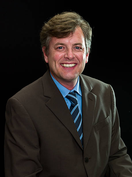 Leadership Caucasian mature business man posing on black background  (this picture has been taken with a Hasselblad H3D II 31 megapixels camera) Bureaucracy stock pictures, royalty-free photos & images