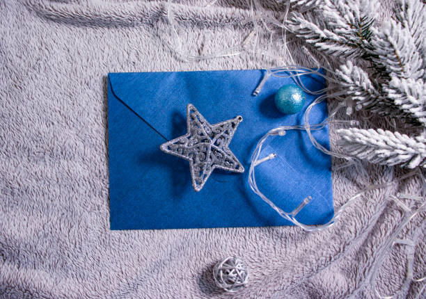 istock envelope, christmas tree branch, alarm clock christmas background 1365021442