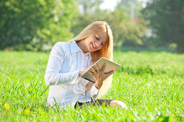 istock Business woman using tablet outdoors 136502292