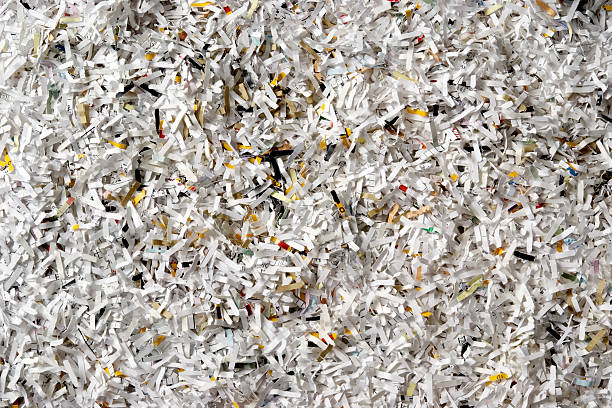 istock Overhead shot of many shredded documents background 136502363