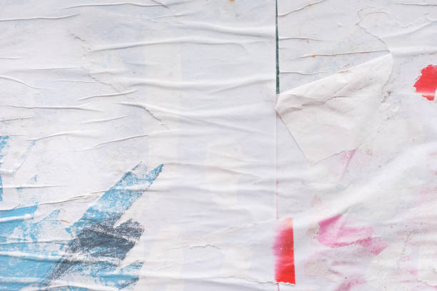 istock Shabby and messy crumpled and torn poster paper texture as graphic design element background 1365026302