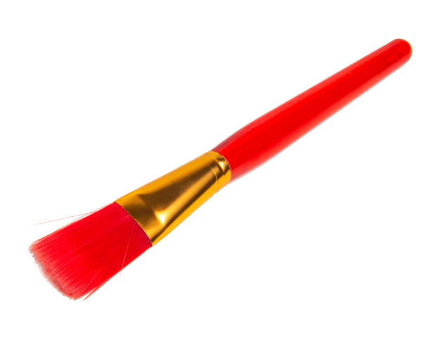 istock Red plastic brush for paint isolated on the white background 1365026693