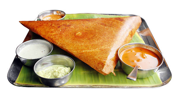 Masala dosa with variety of chutney and sambar stock photo