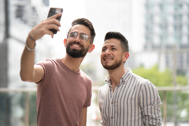istock Young latin friends making a video call 1365034489