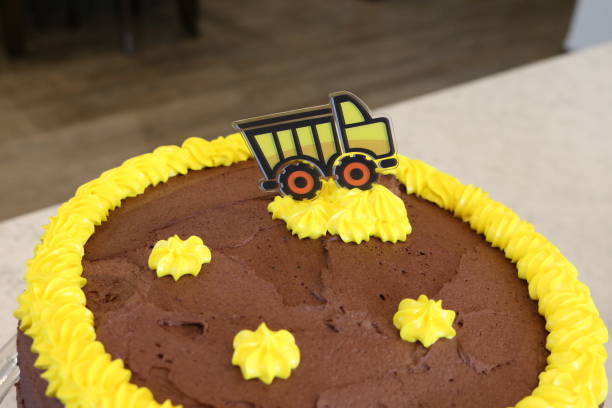 istock Chocolate Cake with yellow dump truck 1365036422