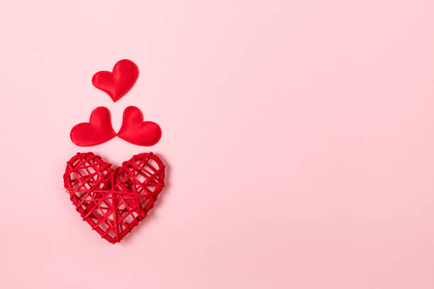 istock Red hearts on a pink background. Minimalistic concept for valentine's day. Place for your text. 1365042773
