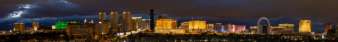 Las Vegas, NV - December 30 2021:  Las Vegas skyline as the lights come on with clouds moving over